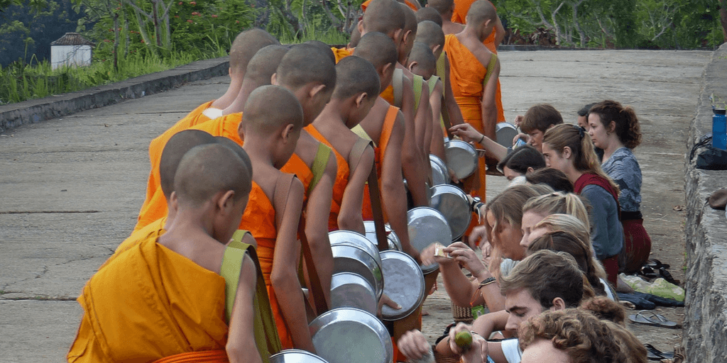 volunteer with buddhist monks in laos, asia