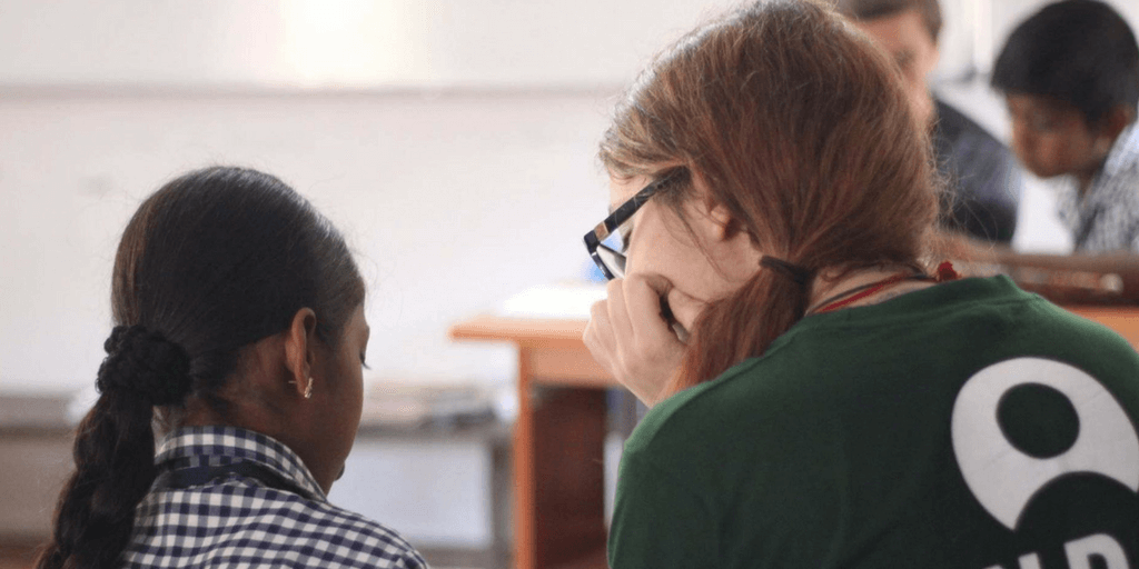 GVI volunteers in Kerala work on teaching programs with school students.